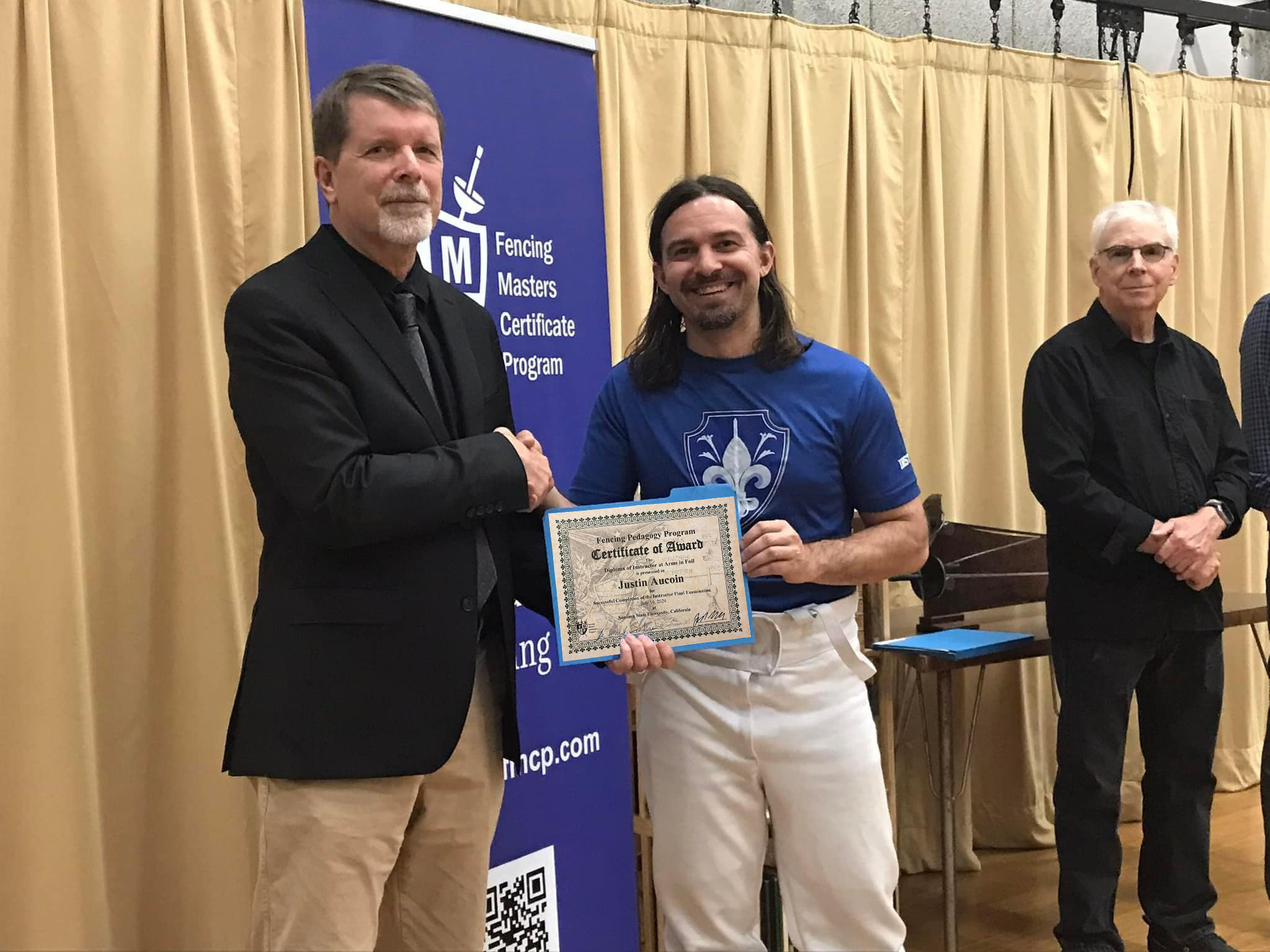 Justin Aucoin receiving his Instructor at Arms certificate at SSU FMCP